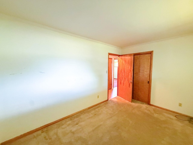115 Horseshoe St, Pulaski, TN 38478 - unfurnished bedroom with crown molding, carpet floors, and a closet
