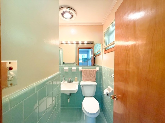 115 Horseshoe St, Pulaski, TN 38478 - half bathroom featuring crown molding, tile walls, a wainscoted wall, and tile patterned flooring