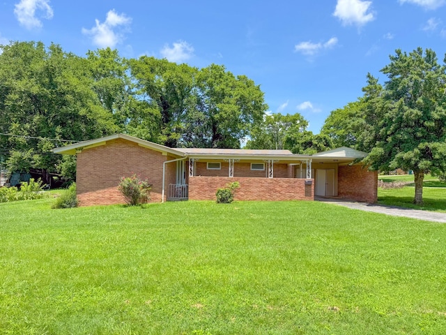 115 Horseshoe St, Pulaski, TN 38478 - single story home with a front yard, a carport, and brick siding