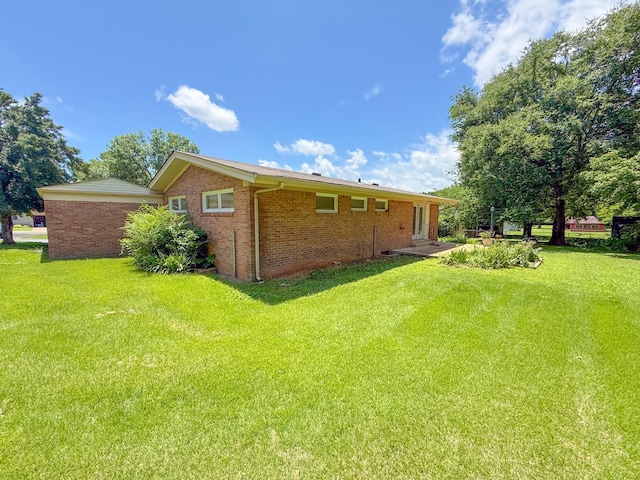 115 Horseshoe St, Pulaski, TN 38478 - rear view of house featuring a yard and brick siding