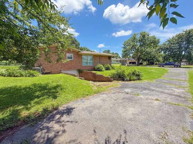 115 Horseshoe St, Pulaski, TN 38478 - view of side of home with brick siding and a yard