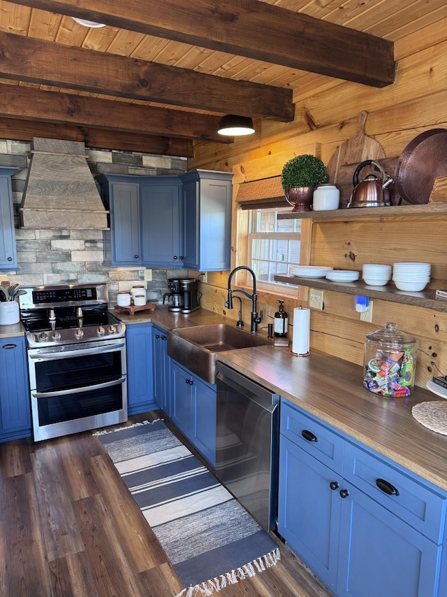 139 E Swan Ridge Rd, Hilham, TN 38568 - kitchen featuring stainless steel appliances, blue cabinets, range hood, dark wood-style flooring, and a wooden ceiling with exposed beams
