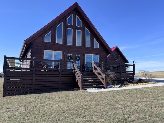 139 E Swan Ridge Rd, Hilham, TN 38568 - log home with a wooden deck and a front yard