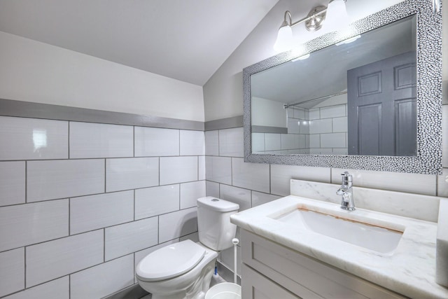 1205 Dr Db Todd Jr Blvd, Nashville, TN 37208 - full bath with tile walls, vanity, vaulted ceiling, and decorative backsplash