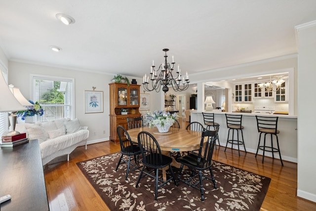227 Riverbend Dr, Franklin, TN 37064 - dining space with a chandelier, wood finished floors, and ornamental molding