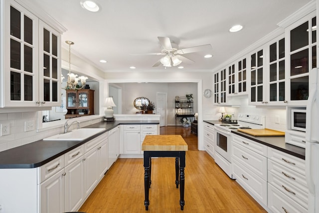 227 Riverbend Dr, Franklin, TN 37064 - kitchen with white appliances, decorative backsplash, wooden counters, glass insert cabinets, and ceiling fan