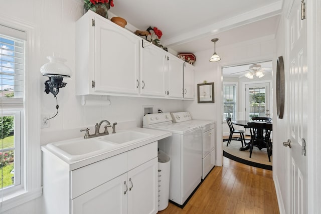 227 Riverbend Dr, Franklin, TN 37064 - laundry area featuring cabinet space, independent washer and dryer, healthy amount of natural light, and light wood-type flooring
