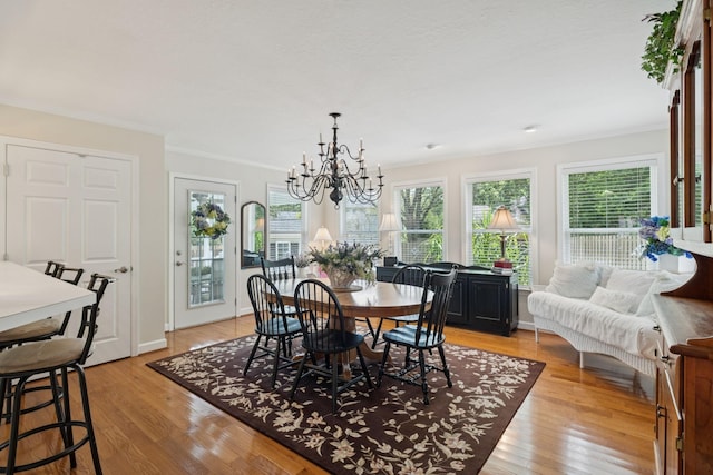 227 Riverbend Dr, Franklin, TN 37064 - dining area featuring a chandelier, light wood-type flooring, and ornamental molding