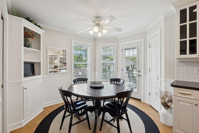 227 Riverbend Dr, Franklin, TN 37064 - dining area with light wood-style flooring, a ceiling fan, and crown molding