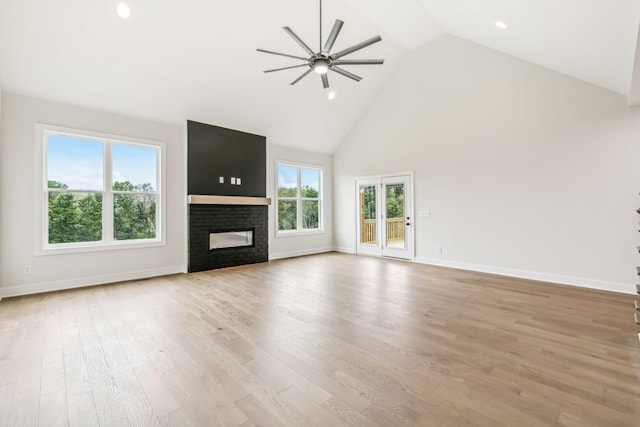 512 Smokey Rdg, Nolensville, TN 37135 - unfurnished living room featuring a ceiling fan, high vaulted ceiling, a glass covered fireplace, light wood finished floors, and recessed lighting