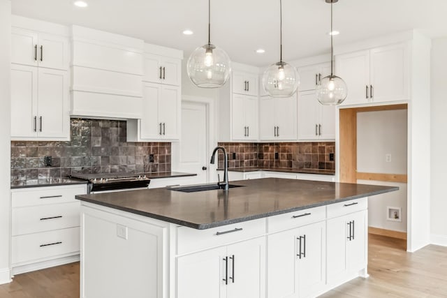 512 Smokey Rdg, Nolensville, TN 37135 - kitchen featuring dark countertops, custom range hood, recessed lighting, and decorative backsplash
