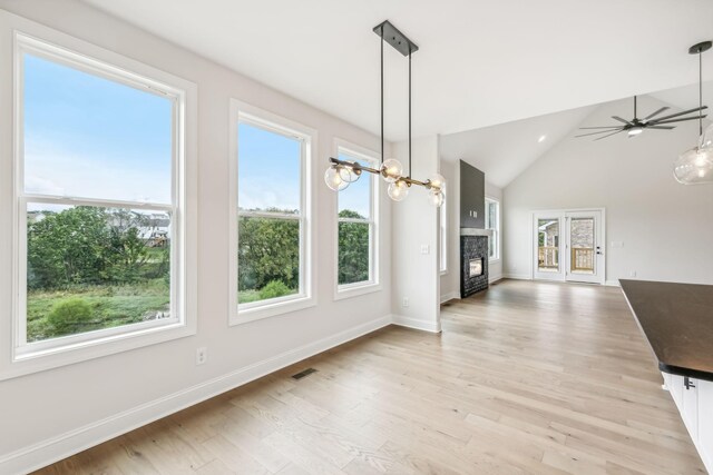 512 Smokey Rdg, Nolensville, TN 37135 - unfurnished dining area with healthy amount of natural light, a fireplace, ceiling fan, light wood finished floors, and high vaulted ceiling