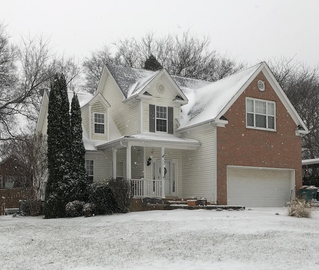 2821 Lafayette Dr, Thompsons Station, TN 37179 - traditional-style house featuring a porch, a garage, and brick siding