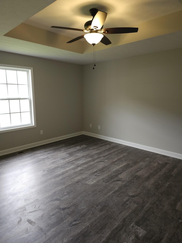 4070 Hartsville Rd, Lafayette, TN 37083 - empty room with ceiling fan and dark wood-style floors