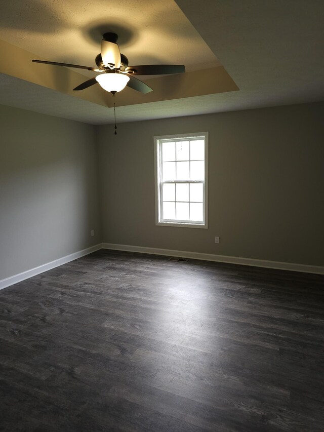 4070 Hartsville Rd, Lafayette, TN 37083 - empty room with ceiling fan and dark wood-style floors