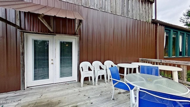 329 Wheeler Ln, Jamestown, TN 38556 - wooden deck with french doors and outdoor dining area