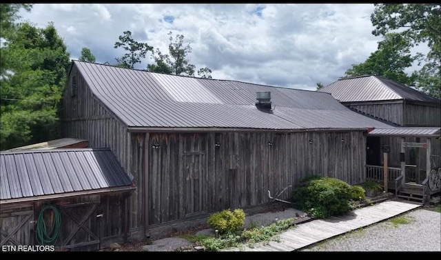 329 Wheeler Ln, Jamestown, TN 38556 - back of house featuring a metal roof