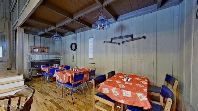 329 Wheeler Ln, Jamestown, TN 38556 - dining space with wood finished floors, a wooden ceiling with exposed beams, and wooden walls