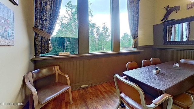 329 Wheeler Ln, Jamestown, TN 38556 - dining space featuring wood finished floors, a wainscoted wall, and wood walls