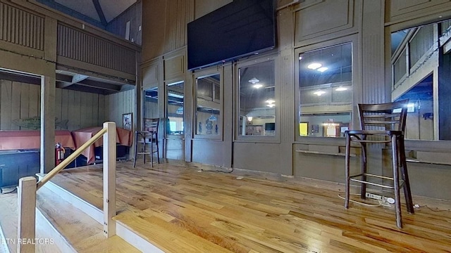 329 Wheeler Ln, Jamestown, TN 38556 - miscellaneous room with wood finished floors, a towering ceiling, and wood walls