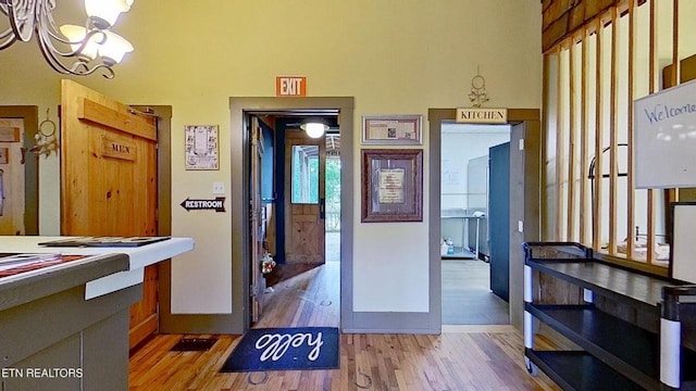 329 Wheeler Ln, Jamestown, TN 38556 - foyer entrance with light wood-style flooring and a chandelier