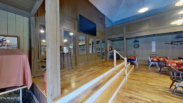 329 Wheeler Ln, Jamestown, TN 38556 - hall with wood finished floors, vaulted ceiling, and wooden walls