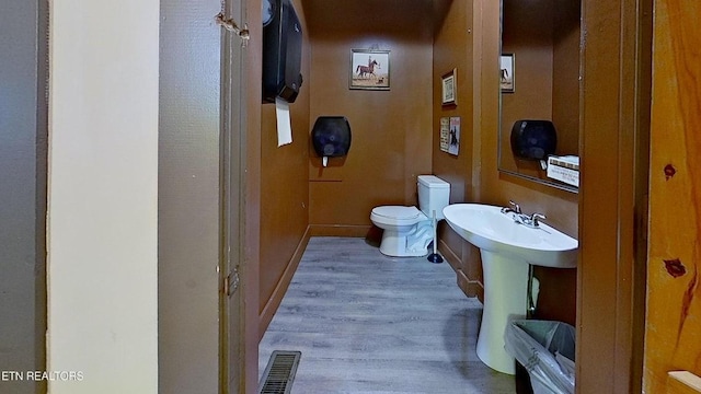 329 Wheeler Ln, Jamestown, TN 38556 - half bathroom featuring wood finished floors and toilet