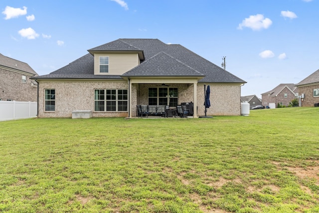 1446 Millstone Creek Rd, Lascassas, TN 37085 - back of property featuring ceiling fan, an outdoor hangout area, a shingled roof, a patio area, and brick siding