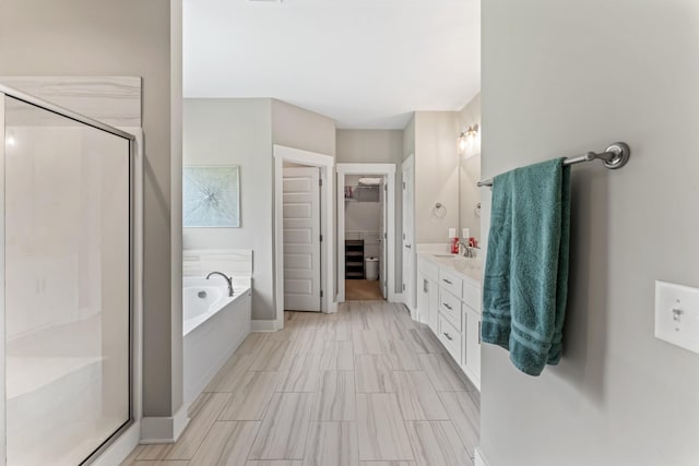 1446 Millstone Creek Rd, Lascassas, TN 37085 - full bathroom featuring a walk in closet, a shower stall, vanity, and a bath
