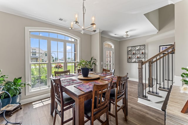 1446 Millstone Creek Rd, Lascassas, TN 37085 - dining space with plenty of natural light, stairway, a chandelier, dark wood-style floors, and ornamental molding