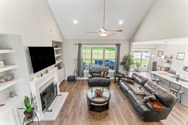1446 Millstone Creek Rd, Lascassas, TN 37085 - living room featuring high vaulted ceiling, a ceiling fan, wood finished floors, a premium fireplace, and recessed lighting