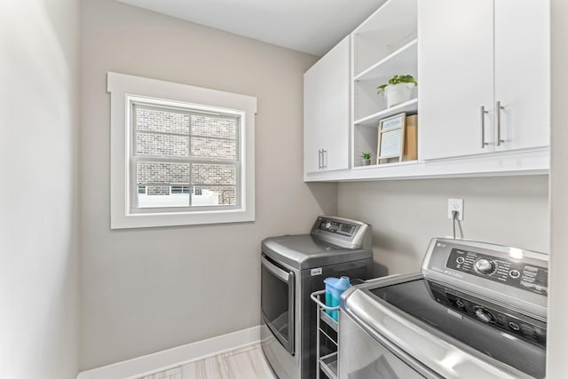 1446 Millstone Creek Rd, Lascassas, TN 37085 - laundry area featuring cabinet space and washing machine and clothes dryer