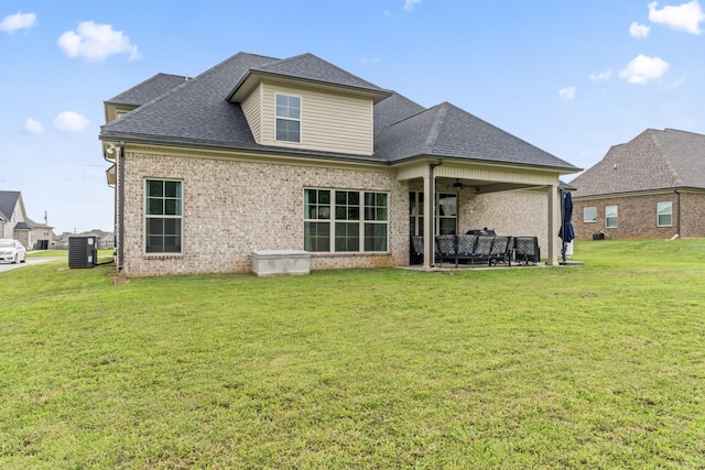 1446 Millstone Creek Rd, Lascassas, TN 37085 - rear view of house featuring ceiling fan, a lawn, a shingled roof, and brick siding