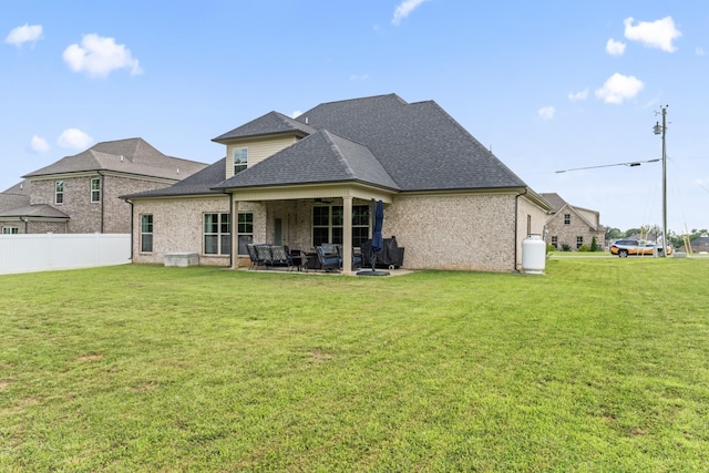 1446 Millstone Creek Rd, Lascassas, TN 37085 - rear view of house with a patio area, roof with shingles, a ceiling fan, brick siding, and outdoor lounge area