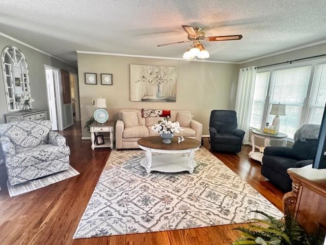 570 Gaines Cir, Estill Springs, TN 37330 - living room with ornamental molding, a textured ceiling, ceiling fan, and dark wood finished floors