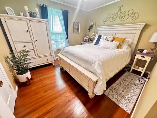 570 Gaines Cir, Estill Springs, TN 37330 - bedroom with wood finished floors and ornamental molding