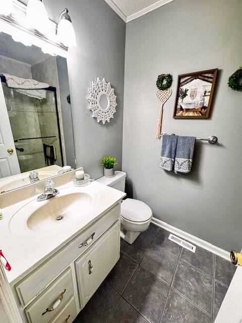 570 Gaines Cir, Estill Springs, TN 37330 - bathroom featuring ornamental molding, vanity, a stall shower, and tile patterned floors