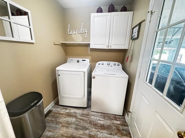 570 Gaines Cir, Estill Springs, TN 37330 - washroom with cabinet space, washing machine and dryer, and dark wood-type flooring