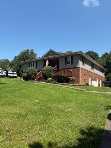 1134 Pee Dee Branch Rd, Cottontown, TN 37048 - single story home featuring a garage, a front lawn, and brick siding