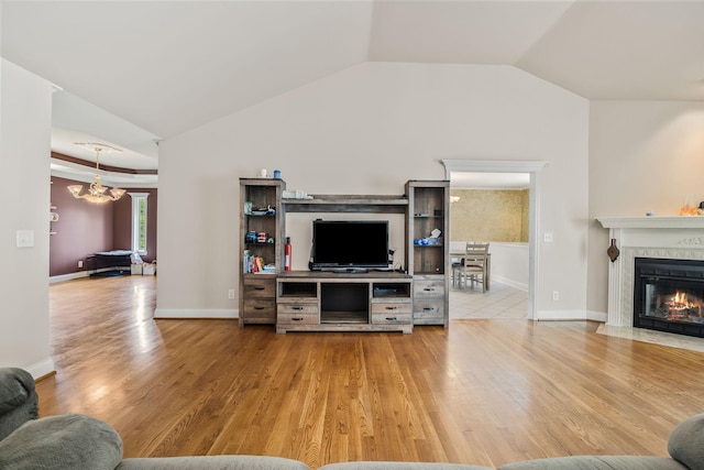 1134 Pee Dee Branch Rd, Cottontown, TN 37048 - living room with light wood finished floors, a high end fireplace, a chandelier, and vaulted ceiling