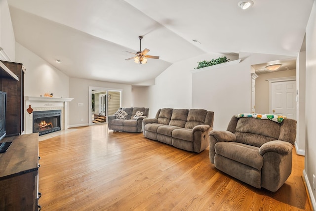 1134 Pee Dee Branch Rd, Cottontown, TN 37048 - living room with ceiling fan, a fireplace with flush hearth, lofted ceiling, and light wood-style floors