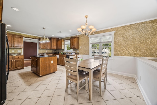1134 Pee Dee Branch Rd, Cottontown, TN 37048 - dining area featuring a chandelier, light tile patterned floors, crown molding, wainscoting, and wallpapered walls