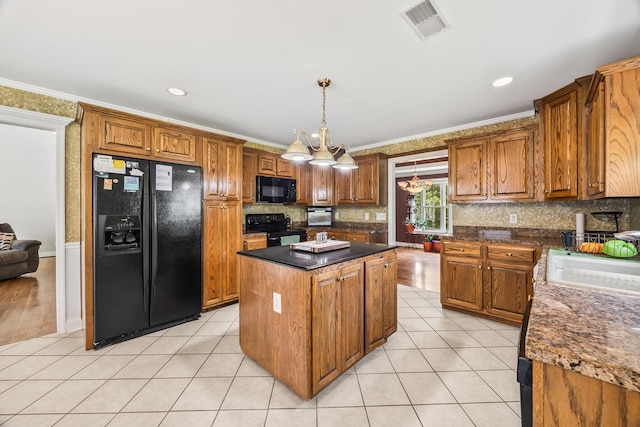 1134 Pee Dee Branch Rd, Cottontown, TN 37048 - kitchen with black appliances, a center island, brown cabinets, ornamental molding, and recessed lighting