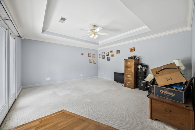 1134 Pee Dee Branch Rd, Cottontown, TN 37048 - empty room featuring a raised ceiling, a ceiling fan, crown molding, and carpet floors