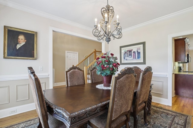 511 Derby Downs, Lebanon, TN 37087 - dining area featuring a chandelier, wood finished floors, stairs, and crown molding