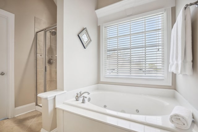 511 Derby Downs, Lebanon, TN 37087 - bathroom featuring plenty of natural light, a shower stall, a tub with jets, and tile patterned flooring