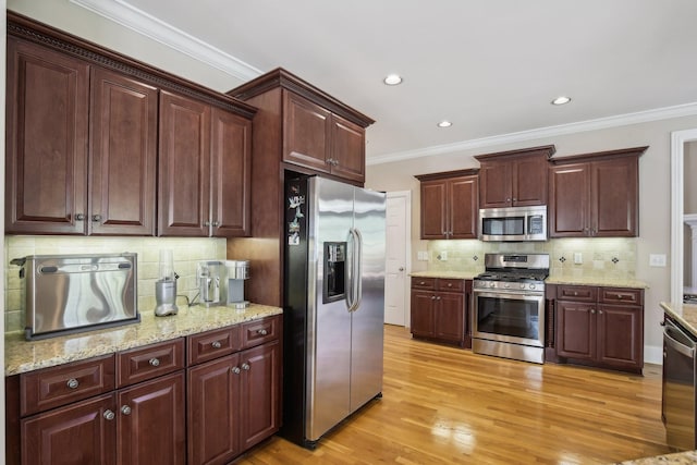 511 Derby Downs, Lebanon, TN 37087 - kitchen featuring stainless steel appliances, crown molding, decorative backsplash, light wood-style flooring, and recessed lighting