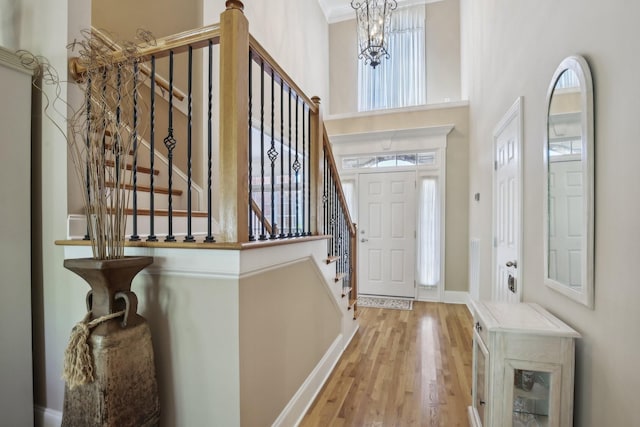 511 Derby Downs, Lebanon, TN 37087 - entrance foyer featuring wood finished floors, a high ceiling, stairway, and plenty of natural light