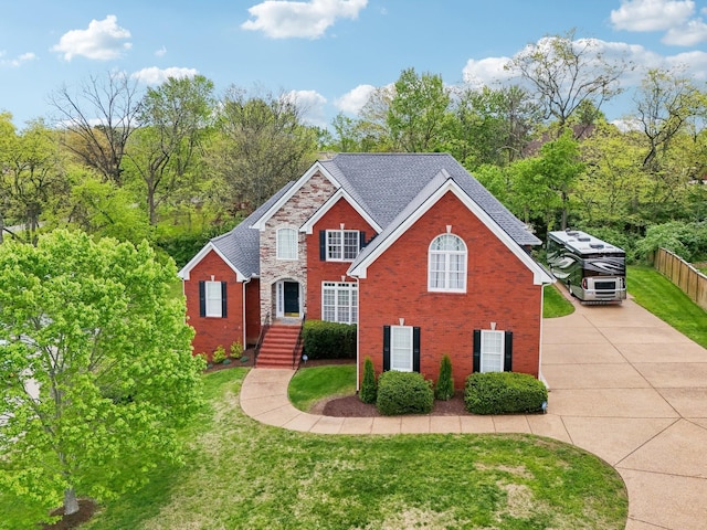 511 Derby Downs, Lebanon, TN 37087 - traditional-style home featuring brick siding, a front yard, and concrete driveway