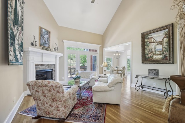 511 Derby Downs, Lebanon, TN 37087 - living area featuring wood finished floors, a chandelier, a fireplace, high vaulted ceiling, and ceiling fan